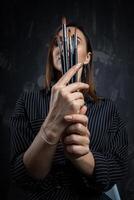 Portrait of a female artist, with brushes in her hands. photo