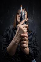 Portrait of a female artist, with brushes in her hands. photo