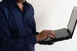 man working on laptop computer photo