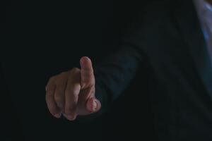 Businessman's hands working using a mobile phone photo