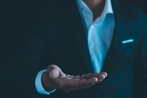 Businessman's hands working using a mobile phone photo