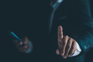 Businessman's hands working using a mobile phone photo