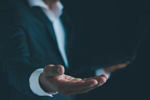 Businessman's hands working using a mobile phone photo