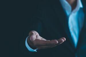 Businessman's hands working using a mobile phone photo