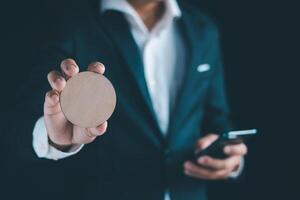 Businessman's hands working using a mobile phone photo