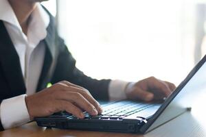 Businessman or accountant working on computer, business documents on office table photo