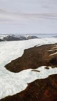 A snow-covered mountain range seen from above video