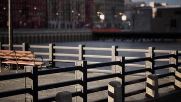 A row of benches sitting next to a body of water video