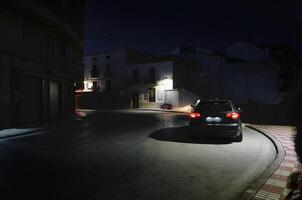 A car on the street at night in the city of Quesada in the province of Jaen. Transportation. Travel and tourism concept photo