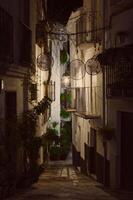 Calle Adentro at night. The most beautiful and famous street in the city of Quesada in the province of Jaen. Travel and tourism concept photo