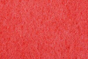 The red texture of the sponge is foam.The background of red foam. photo