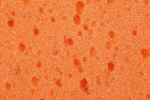 Texture of orange sponge background photo