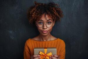 AI generated A young African American woman holds a gift box on a black background photo