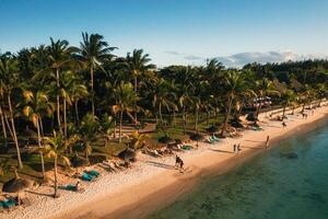 On the beautiful beach of the island of Mauritius along the coast. Shooting from a bird's eye view of the island of Mauritius. photo