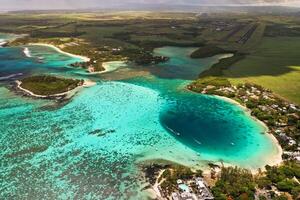 Top view of the Blue Bay lagoon of Mauritius. A boat floats on a turquoise lagoon photo