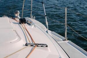 rope on the winch of a white yacht in the sea.yacht equipment photo