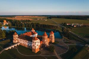 Mir castle with spires near the lake top view in Belarus near the city of Mir photo