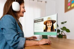 Happy Influencer woman working on computer from her home studio - Smart work and Technology concept photo