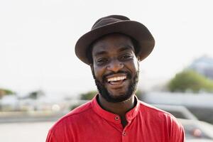 Happy african man having fun smiling in front of camera photo