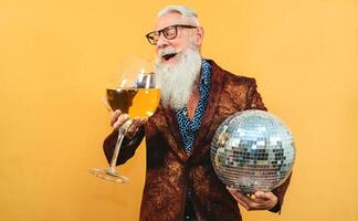 Senior party man celebrating new year's eve in disco club photo