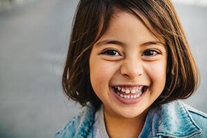 Happy child having fun smiling into the camera photo