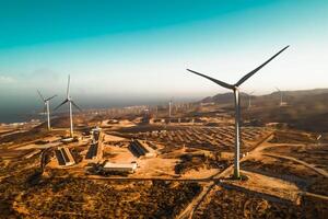 Panoramic view of wind turbine and solar panels in background - Sustainable environment concept photo