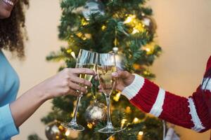Happy African family toasting with champagne during Christmas holidays photo