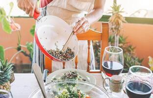 Chef serving vegan salad for dinner in farmhouse - Father cooking and preparing vegetarian food for family lunch - Healthy people lifestyle concept photo