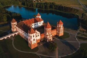 Mir castle with spires near the lake top view in Belarus near the city of Mir photo