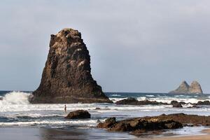 People on the sandy beach of Benijo on the island of Tenerife.Spain photo