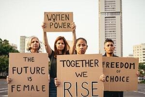 Demonstration of feminist movement protesting for female rights - Women empowerment concept photo