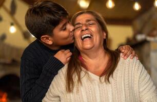 Happy smiling Hispanic grandmother and his grandchild having tender moment together - Family love and unity concept photo