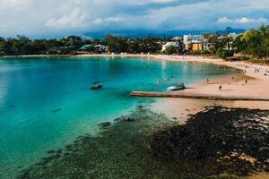 Aerial picture of the east coast of Mauritius Island. Beautiful lagoon of Mauritius Island shot from above. Boat sailing in turquoise lagoon photo