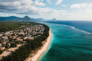 On the beautiful beach of the island of Mauritius along the coast. Shooting from a bird's eye view of the island of Mauritius. photo