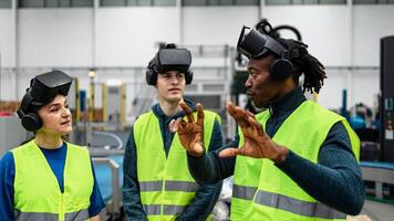 Team of multiracial engineers having a simulation experience with futuristic virtual reality glasses inside robotic factory - Tech industry and metaverse concept photo
