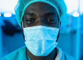 Portrait of doctor wearing protective face mask fighting against corona virus outbreak - Health care and medical worker concept photo