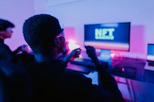 Young gamers having fun playing on decentralized NFT gaming blockchain platform with virtual reality glasses at home - Gaming entertainment and technology concept photo