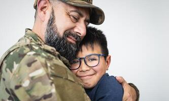 Military soldier embracing his son before leaving for the war photo