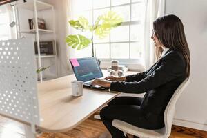 Business stock trader woman working on crypto currency markets at home - Decentralized finance and stock exchange concept photo