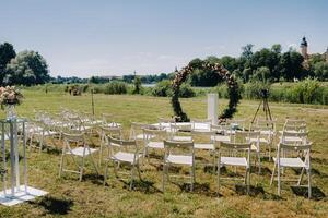 Wedding ceremony on the street on the green lawn near the Nesvizh Castle.Belarus photo