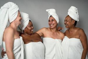 Happy females with different age and body size having skin care spa day - People selfcare concept photo