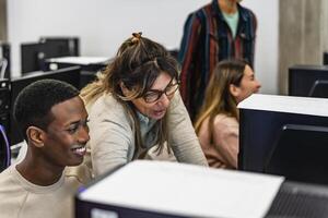 Young Afro American student with teacher during university lesson in classroom - Education and technology concept photo