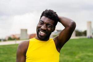 Happy African gay man celebrating pride festival - LGBTQ community concept photo