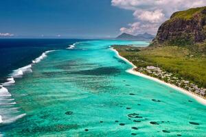 View from the height of the island of Mauritius in the Indian Ocean and the beach of Le Morne-Brabant photo