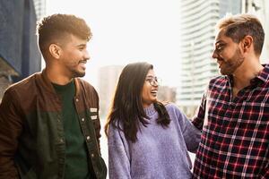 Young multiracial friends having fun in the city - Friendship and diversity concept photo