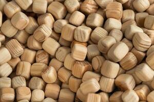 Lots of small wooden cubes. Background of wooden cubes photo