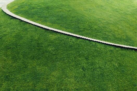 A sloping staircase going up to the sky, a Hill with a staircase in the up photo