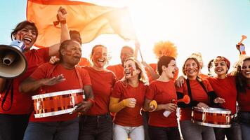 Football fans having fun cheering their favorite team - Soccer sport entertainment concept photo