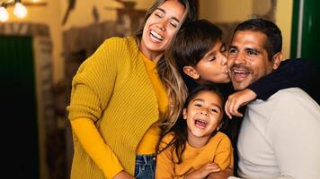 Happy Hispanic family having fun together photo