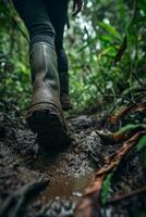 AI generated A man walking through mud in the middle of the jungle in rainy weather photo